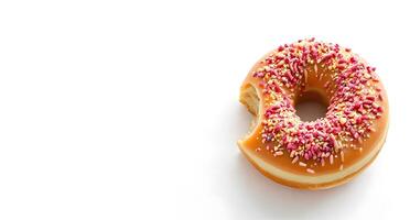 A donut with sprinkles on top of a white background photo