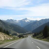A view of a mountain range from a car photo