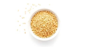 Sesame seeds in a bowl on a white background photo