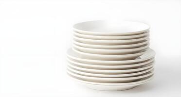 Stack of white plates on a white background photo