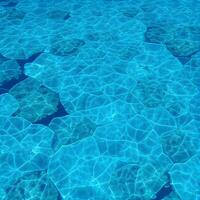 The water is clear and blue with small rocks photo