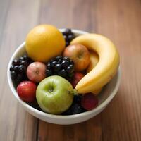 A bowl of fruit on a table photo