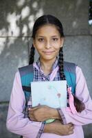 School Friends Smiling Showing Whiteboard In Front Of The Camera photo