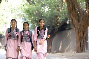 A Secondary Girl Student Making A Pose In Front Of The Camera While Holding Bag photo