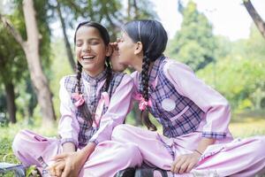 Female Friends Laughing While Playing Games In The Park photo