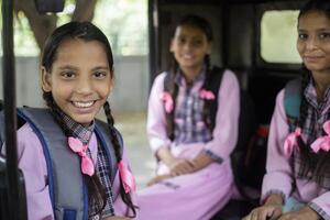 Female Students Are Holding Each Other And Going To School Through The Park photo