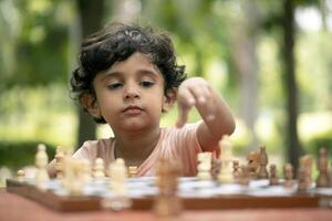 Little Fellow Playing Chess photo