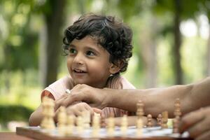 Happy Kid Playing Chess Game photo