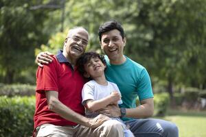Male Family Members Smiling While Looking At Camera photo
