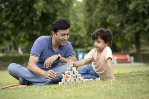 Image Of Father And Son Play With Building Blocks photo