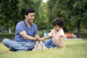 Picture Of Father And Son Play With Building Blocks photo
