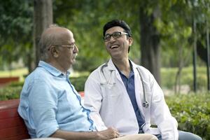 Doctor Patient Having Talk In Park photo