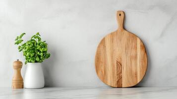 Wooden cutting board on a white counter photo