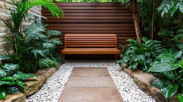 A bench in a garden with plants and a wooden fence photo