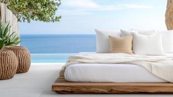 A bed with white linens and pillows sitting on a white patio photo