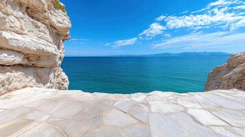 A stone walkway leading to the ocean photo