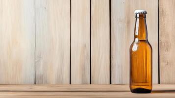A brown beer bottle sitting on a wooden table photo