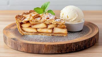 A slice of apple pie with ice cream on top photo