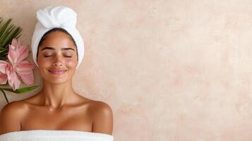 A woman in a towel with a flower photo