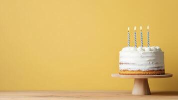 A cake with candles on top of it on a wooden stand photo
