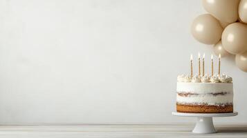 A cake with candles on top of a white table photo