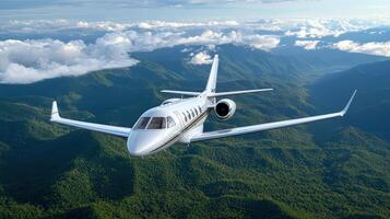 A white private jet flying over a mountain range photo