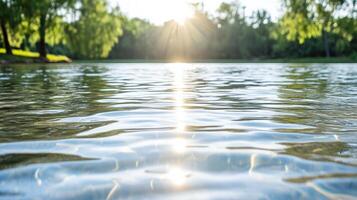 A lake with water and trees in the background photo