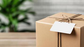 Brown cardboard box with label on wooden table photo