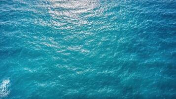 An aerial view of the ocean with waves photo