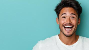 A man is making a funny face while standing in front of a blue background photo