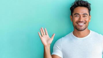 A man is smiling and waving his hand photo