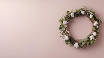 A wreath of white flowers on a pink background photo