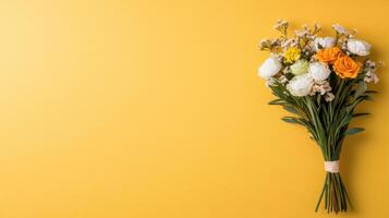 Bouquet of flowers on yellow background photo