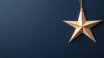 Golden star hanging on a blue background photo