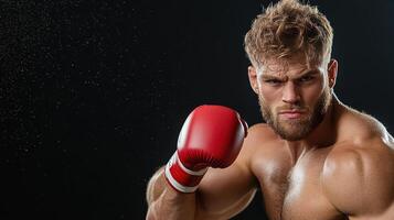 A man with a red boxing glove on his hand photo