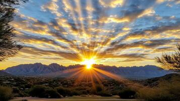 The sun rises over the mountains in arizona photo