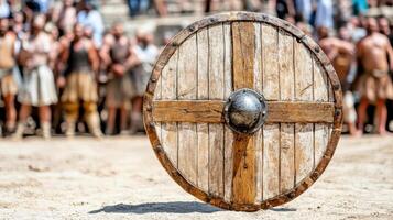 A wooden shield with a large wooden shield in front of a crowd photo