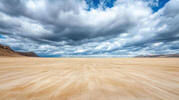 A desert with a cloudy sky and sand photo