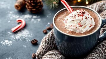 Hot chocolate with whipped cream and candy cane photo