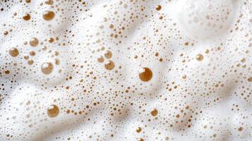 A close up of a white foam with brown bubbles photo