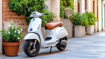 A white scooter parked on the side of a street photo