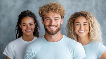 Three smiling people standing together photo