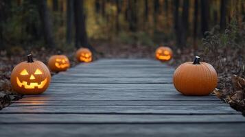 Halloween pumpkins on a wooden walkway photo