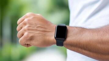 A man wearing a black smart watch photo