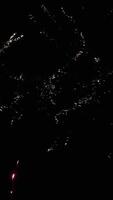 Multicolored aerial fireworks. Festive background of sparkling lights and flashes of salute. with sound video