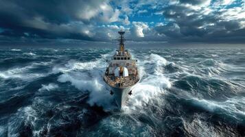 A navy ship in rough seas with storm clouds photo