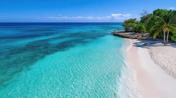 A beach with white sand and turquoise water photo