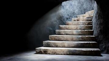A set of stairs leading to a light in a dark room photo
