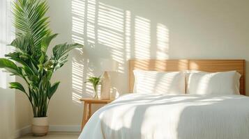 A bed with white sheets and a plant on the window sill photo