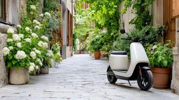 A white scooter parked on a cobblestone street photo